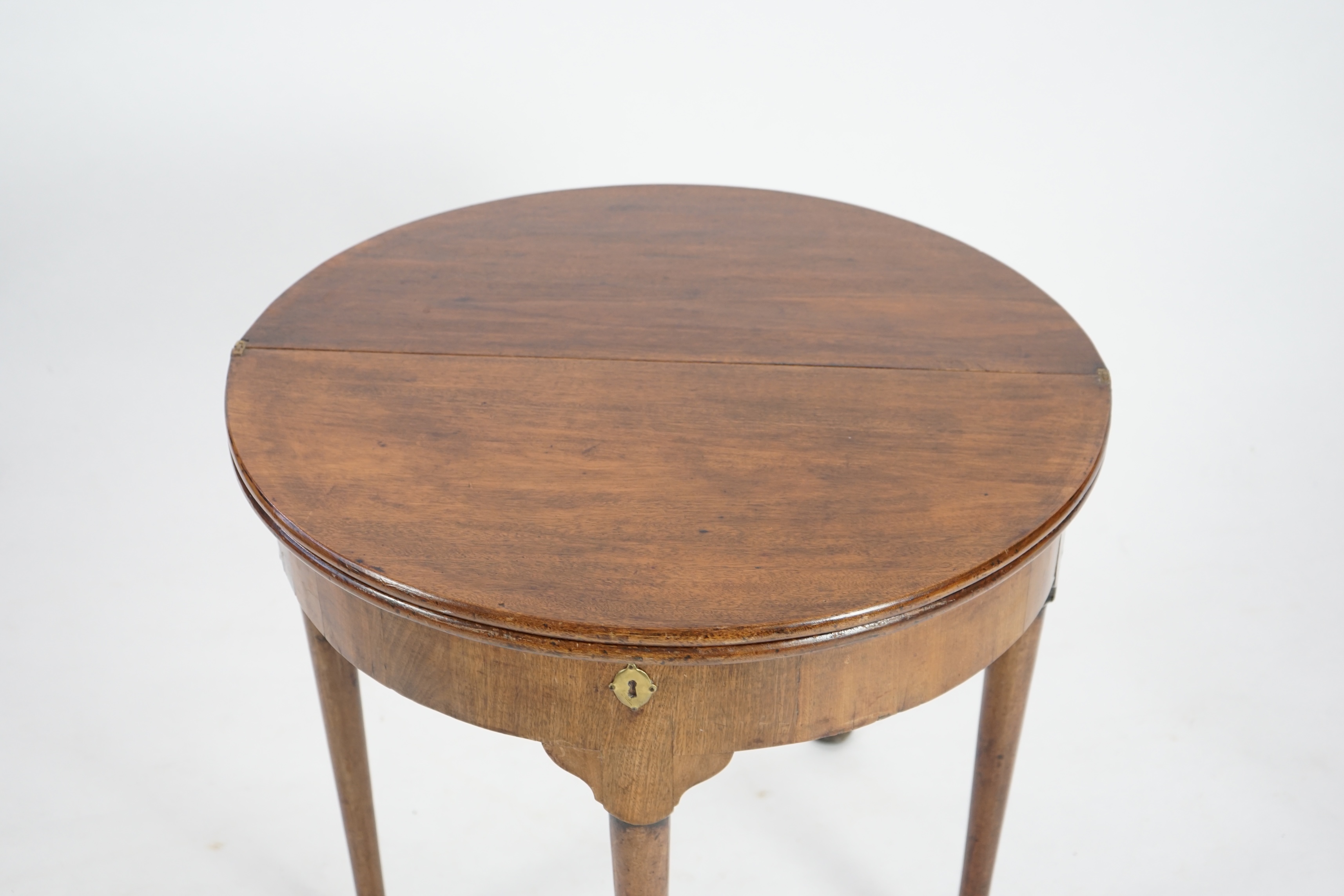 A George III mahogany triple top tea and games table